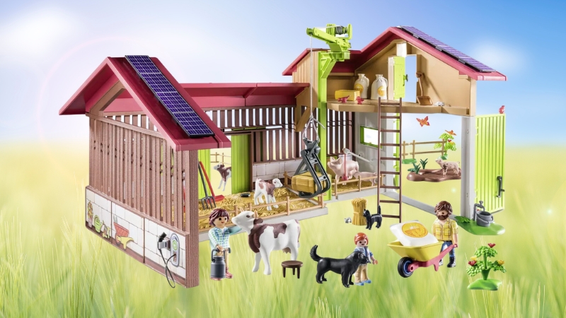 Playmobil Country Farm Set with figures, animals, and detailed buildings arranged to show daily farm life